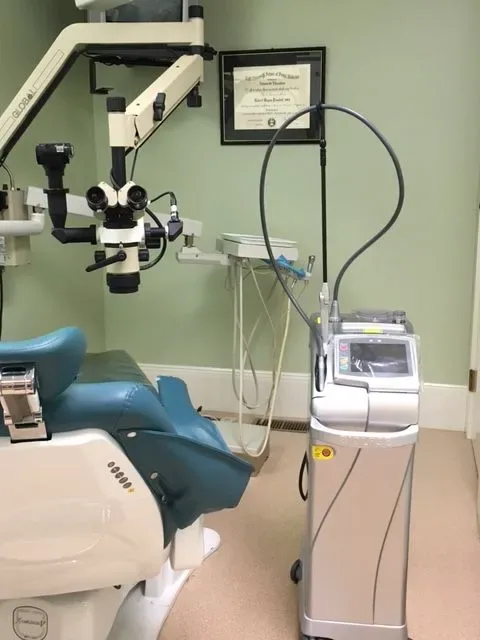 Treatment room with surgical microscope and laser